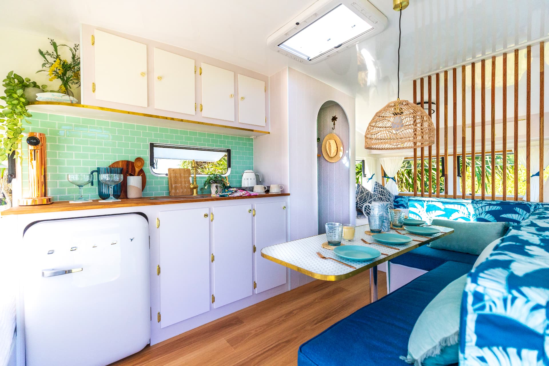 Coastal Cruiser interior — kitchenette, dining lounge and retro details